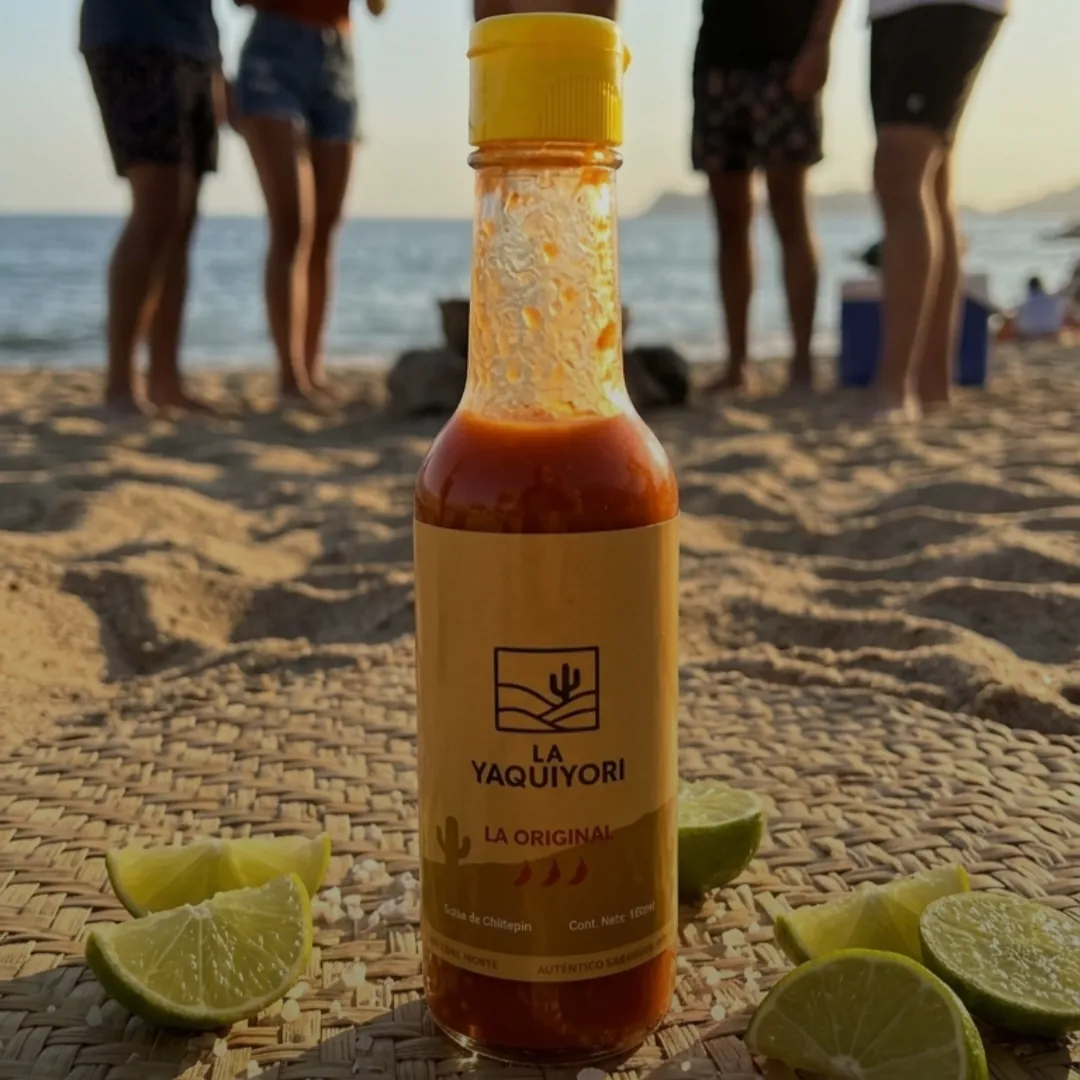 Glass bottle of artisanal wild chiltepin hot sauce by La Yaquiyori
